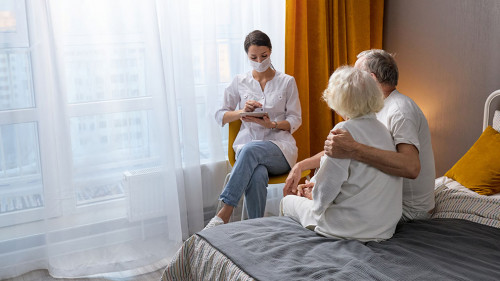 Responsive doctor ask about health condition of senior couple, at home