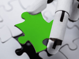 Robot Holding Green Jigsaw Puzzle