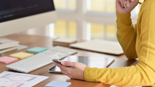 UI creative designer designing wireframe layout for responsive mobile smartphone application