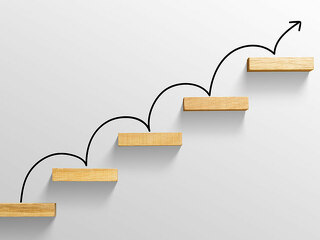 rising arrow on staircase, increasing business