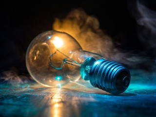 Abstract dark background with creative artwork decoration of glowing bulbs.