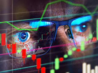Close up of stock market trader looking at graph
