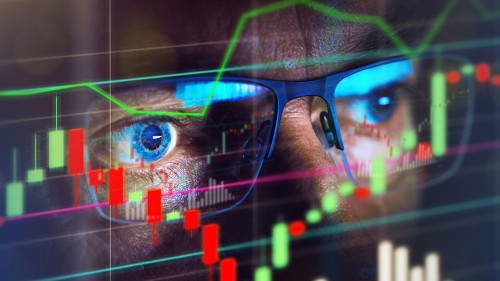 Close up of stock market trader looking at graph