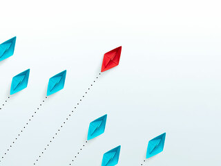 Business competition and leadership concepts with paper ships on