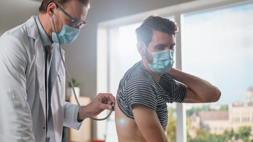 Doctor Consultation Office: Physician Listens to Patient's Lungs
