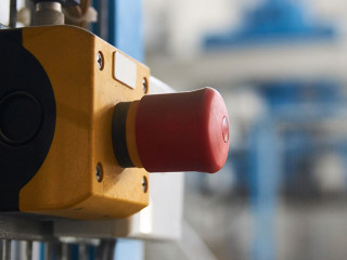 Start or stop button for industrial machine, close-up