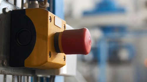 Start or stop button for industrial machine, close-up