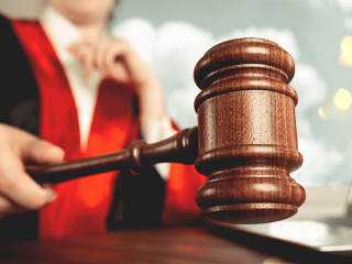 Man holds gavel judge with lawyer