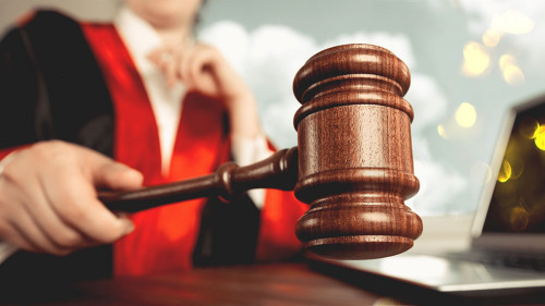 Man holds gavel judge with lawyer