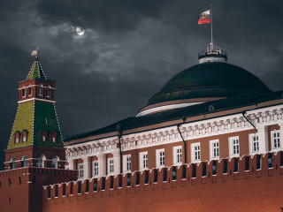 Dark night shot of Russian Kremlin: Senate dome, tower, wall