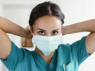 Young female doctor in medical office. Beautiful female doctor p