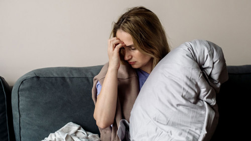 young woman with long covid syndrome - painful condition, headac