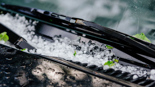 Large hail ice balls on car hood
