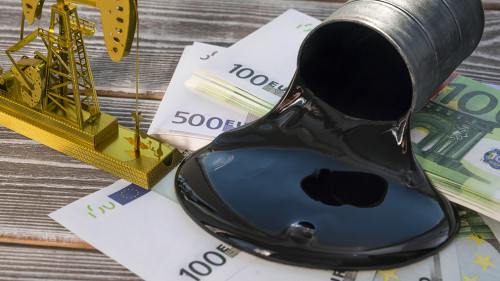 Concept of gold oil drilling a pump, spilled oil from a barrel o