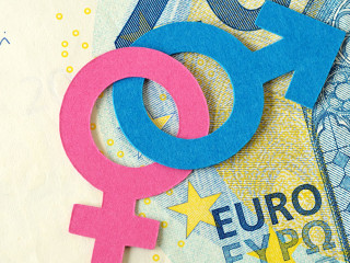 Male and female gender symbols chained together on euro banknote