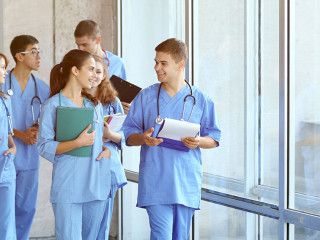 Young students in hall of university indoors