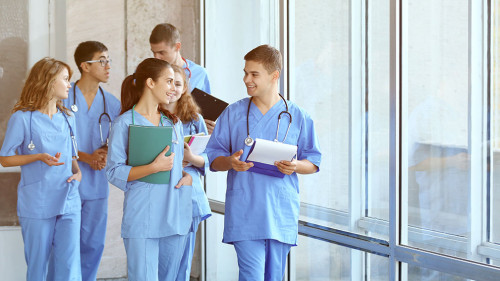 Young students in hall of university indoors