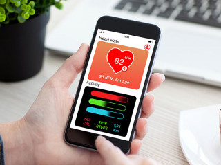 Women hands holding phone with app health tracking activity scre