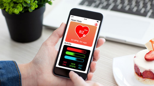 Women hands holding phone with app health tracking activity scre