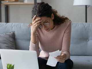 Unhappy young woman feeling stressed of lack of money.