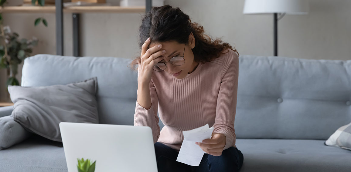 Unhappy young woman feeling stressed of lack of money.