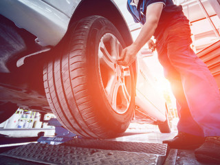 Automotive suspension test and brake test rolls in a auto repair service.