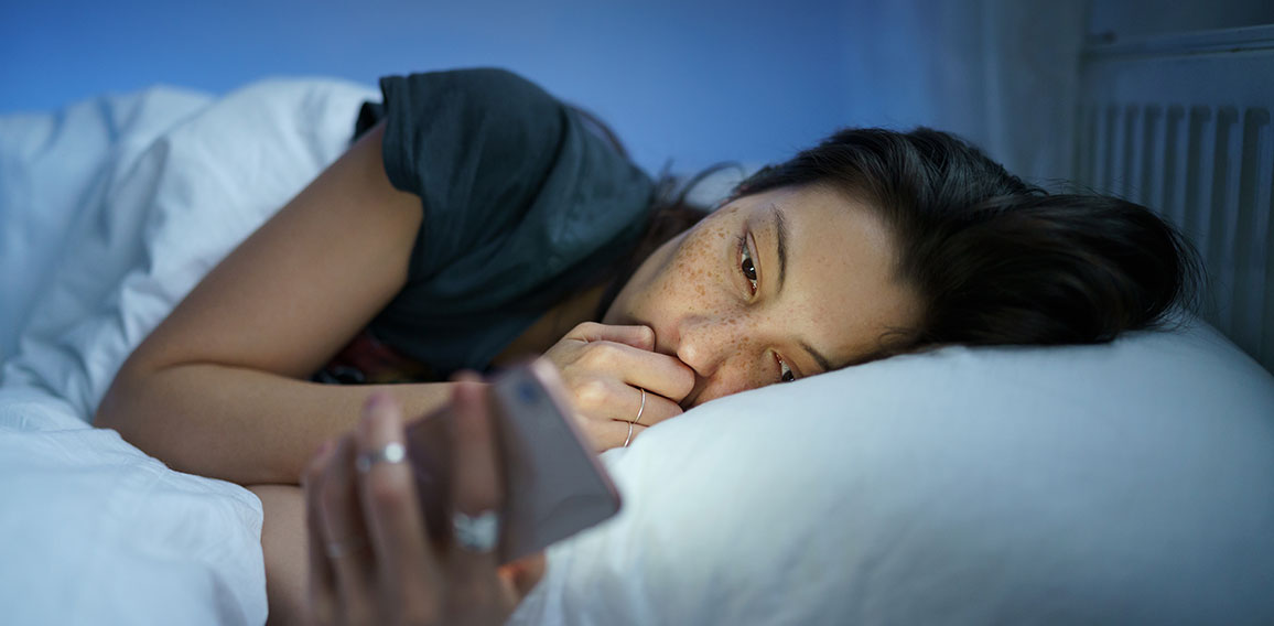 Unhappy girl follow cheating boyfriend in social media lying sleepless in bed suffer from insomnia
