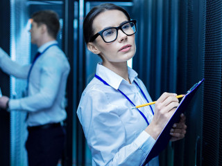 Serious colleagues working in the data center