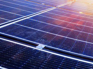 Renewable energy system with solar panel for electricity and hot water