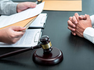 Male lawyer discussing negotiation legal case with client meetin