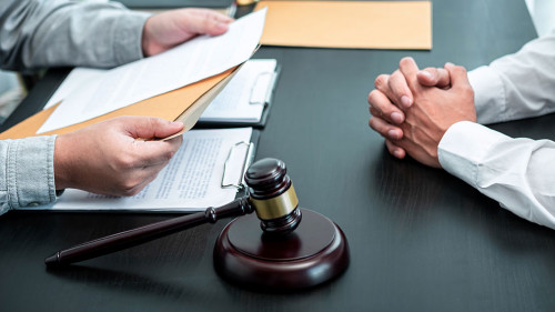 Male lawyer discussing negotiation legal case with client meetin