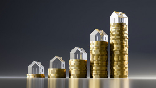 3d render: Rising stacks of Euro coins topped with model houses made from acrylic glass. Seamless dark background and reflections. Concept for extreme rise of housing prices.