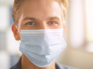 Portrait of the Handsome Stylish Young Man Wearing Protective Fa