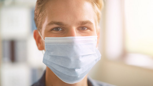 Portrait of the Handsome Stylish Young Man Wearing Protective Fa