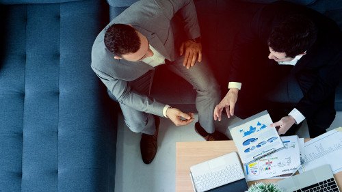 Top View. Businessmen of different nationality sitting in consul