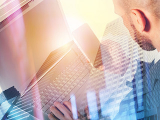 Businessperson in office connected on internet network with laptop