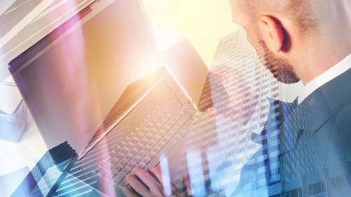 Businessperson in office connected on internet network with laptop