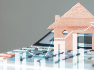 House Miniature model on calculator with over digital chart repo