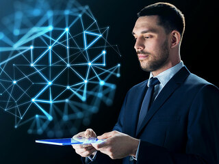 businessman with tablet pc and network projection