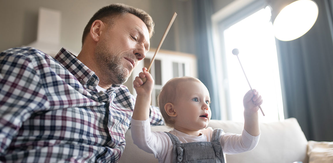 Cute little girl feeling happy palying with xylophone