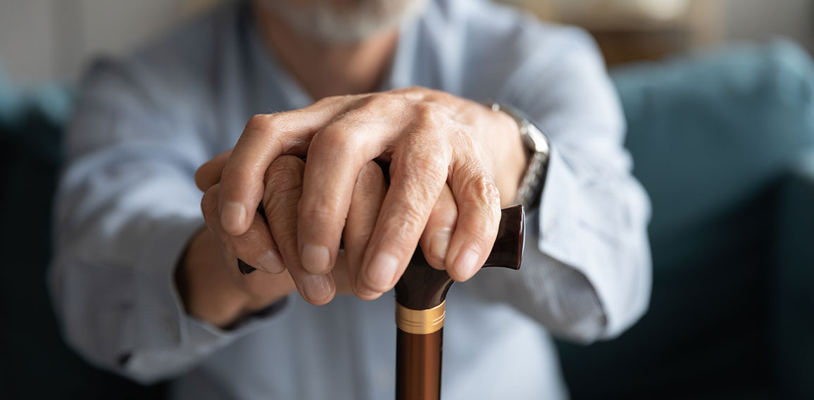 Close up of lonely old man with cane missing