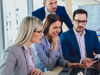 Creative business people working on business project in office u