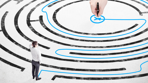 Businessman in front of labyrinth