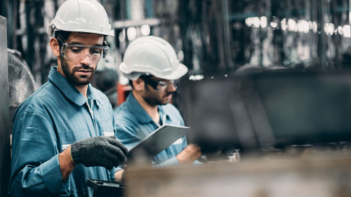 Engineer team in industry factory working setting machine with s