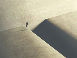 man thinking about taking big risk to reach the other side with