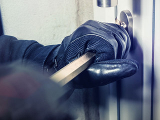 masked burglars breaking and entering into a victim's home