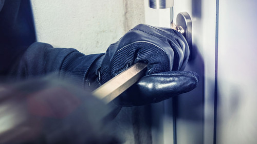 masked burglars breaking and entering into a victim's home