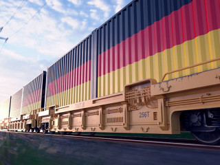 German exports. Freight train with loaded containers in motion.