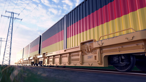German exports. Freight train with loaded containers in motion.