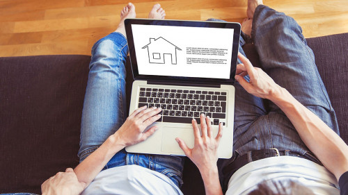 young family couple choosing new home online, search real estate